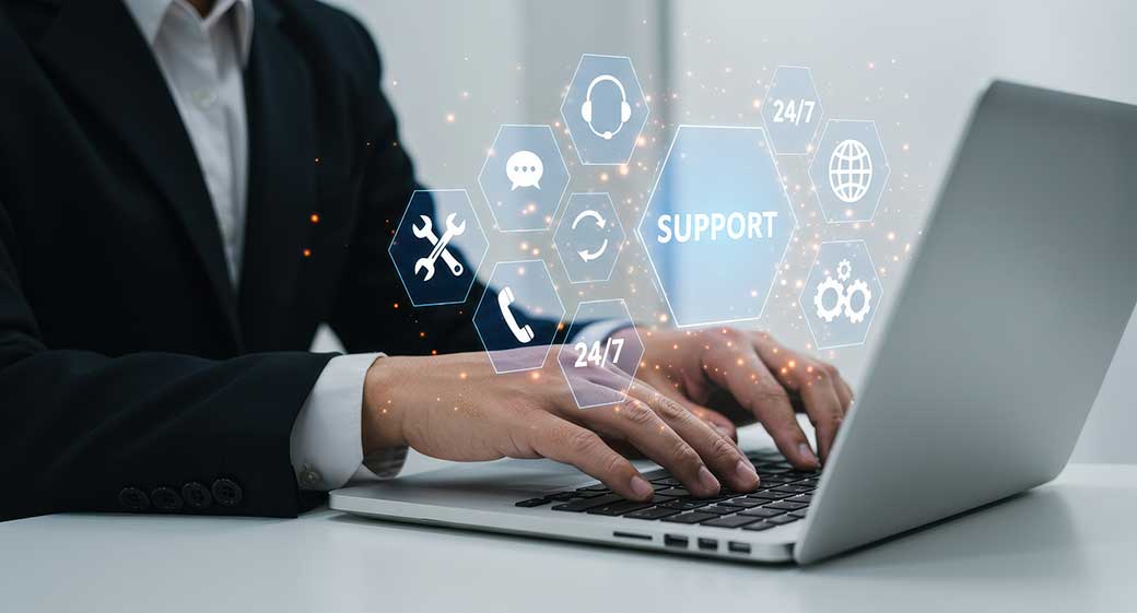 A businessman using a laptop to get it support 24 / 7